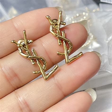 fake ysl logo earrings|YSL lipstick earrings.